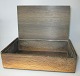 Cigarette case, 
bog oak, 
Denmark, 1960. 
With inlay in 
the lid and the 
initials KB. L 
.: 24 cm. B ...