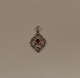 14kt white gold 
pendant with 
ruby 
&#8203;&#8203;and 
diamonds. 
Stamped 14kt, 
BTC. 
Measures ...