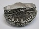 Arabic silver 
bracelet, 20th 
century. With 
filigree work. 
With text. Dia 
.: 5.5 cm. No 
visible ...