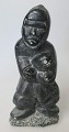 Soapstone 
Figure, Canada, 
20th century. 
Man with fish. 
Signed. 665. H 
.: 15.5 cm. 
With label ...