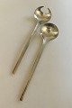Georg Jensen 
Stainless 
'Tuja' Serving 
Set. Both 
pieces measures 
21.2 cm L (8 
15/32").