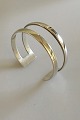 Hans Hansen 
Sterling Silver 
Armring. 
Measures 6 x 
5.5 cm dia. 2.4 
cm W. Weighs 38 
g / 1.30 oz.