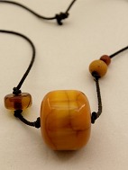 Leather strap with a piece of amber