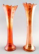 A pair of 
american 
pressure glass 
vases. Mid 20 
c.
Red and yellow 
decoration.
Measures 30 
...