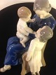 Figure
a happy family 
mother sitting 
in a chair and 
having fun with 
her two 
children.
Bing & ...