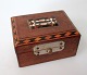 Box of walnut 
wood with 
inlays and in 
coatings of 
semi-precious 
stones. Inlaid 
name .: 
Karlbad. ...