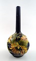Art nouveau 
Rörstrand 
narrow-neck 
vase in 
earthenware 
decorated with 
flowers.
28 cm. high.
In ...