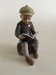 Dahl Jensen 
Figurine of Boy 
Reading No 
1096. Measures 
14 cm / 5.5 
inch.
