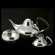 Georg Jensen. 
Sterling Silver 
Tea Set #1017.
Teapot, 
Creamer & Sugar 
Bowl.
Teapot handle 
of ...