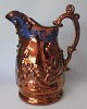 English Fayance 
milk jug with 
lustra, 19th 
century. With 
painted blue 
decorations. 
Decorations ...