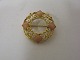 Evald Nielsen 
14.Karat gold 
brooch stamp EN 
585Ø. 3cm.