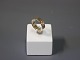 Broad goldring 
in 14 carat by 
Braemer Jensen. 
Size 58.