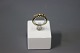 Alliance 
goldring in 14 
carat with 5 
cut diamonds, 
ingraved F.M. 
Dia - 1,8 cm.