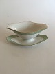 Royal 
Copenhagen 
Green Curved 
with Gold 
Sauceboat No 
1871. 12.5 x 25 
cm (4 59/64" x 
9 27/32")