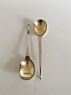 Set of two 
serving spoons 
in English 
Silver, partly 
gilded. 20 cm 
(7 7/8")