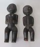 Par African 
carved wooden 
figures, 20th 
century. A 
woman and a 
child. Eyes 
with beads. H 
.: ...