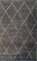 A handknotted 
Beni Ouarain 
Maroccan tribal 
rug, made of 
natural colored 
light gray wool 
with ...