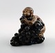 Bing & Grondahl Figurine of boy with bunch of grapes by Kai Nielsen.
Model number 4027. From the series 