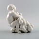 Bing & Grondahl / B & G, blanc de chine porcelain figure of faun with grapes by 
Kai Nielsen.