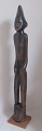 African wood 
figure of a 
naked man. 20th 
century. H .: 
81 cm. On a 
square foot.