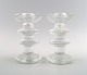 A pair of Iittala Festivo candlesticks, Design: Timo Sarpaneva.
