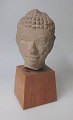 Buddha 
sandstone 
figure, 19th 
century. 
Presumably 
Cambodia, 19th 
century. On 
wooden stand. H 
.: ...