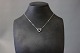 Necklace in 14 
ct. White gold 
with a pendant 
of Black and 
White diamonds.
42 cm.