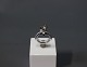 Ring in 14 ct. 
whitegold with 
large diamond, 
1,8 ct., 
clarity P1, 
color 
grey/Brown 
along with ...