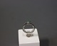 14 ct. White 
gold ring with 
a gem and 
diamond. 
Size 56.