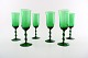 SIMON GATE ORREFORS, A set of six green champagne art glasses. 
