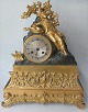 French guilded 
mantle clock, 
ca. 1830-1840. 
Decoration in 
the form of 
sleeping boy 
with stringed 
...