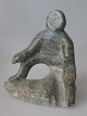 Greenlandic soapstone figure, 20th century. Seated man. Signed: ML 12/09/74. H .: 10 cm.