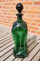 Cluck cluck 
decanter or 
cluck bottle in 
dark-green 
glass with 
attached neck, 
from a Danish 
...
