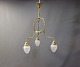 Ceiling lamp in brass and Art Noveau. The lamp is from 1910 and has recently 
been refurbished.
5000m2 showroom.