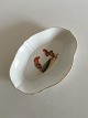 Oval Dish with 
two Gnomes and 
Cucumber. 22.5 
x 15.5 cm (8 
55/64" x 6 
7/64"). The 
gold on the ...