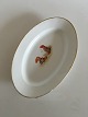 Oval Serving 
Dish with Two 
Gnomes 
Contemplating 
Dinner. The 
gold on the 
border is 
partly worn ...