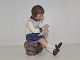 Dahl Jensen figurine, girl knitting.The factory mark tells, that this was produced between ...