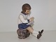 Dahl Jensen 
figurine, girl 
knitting.
The factory 
mark tells, 
that this was 
produced 
between ...