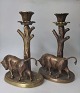 Pair of bronze 
candlesticks, 
Denmark, app. 
1930. Decorated 
with bulls on 
oval base near 
a tree ...