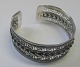 Arm ring in 
sterling 
silver. 20th 
century. Dia .: 
5.5 cm. Weight: 
25.2 grams. 
Stamped .: 925