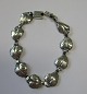 Arm band in 
silver, Herman 
Siersbøl, 
Kastrup 
Copenhagen 
(after 1948). 
Length .: 15.5 
cm. Weight ...