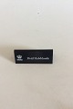Royal 
Copenhagen 
Dealer 
Advertising 
Sign in Plastic 
"Hvid 
Halvblonde"
Measures 
10,5cm x 4,2cm