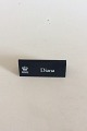 Royal 
Copenhagen 
Dealer 
Advertising 
Sign in Plastic 
"Diana".
Measures 
10,5cm x 4,2cm
