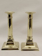 A pair of Empire Candlesticks sold