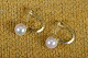 Earrings  in 
gold and 
genuine pearls, 
 closed with 
screw lock. 
Stamped 585 HS 
(Herman 
Siersbøl ...