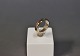 Simpel 18 carat 
redgold ring 
with small 
emerald, 
stamped E.G.J.
str 56