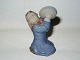Royal 
Copenhagen 
Figurine, Girl 
with Pot 
Covers.
Decoration 
number 3677.
Factory ...