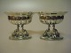 A pair of 19th 
century salt 
vessels inside 
gilded oval 
foot with 
dolphins 
clearly stamped 
H. ...