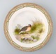 Royal Copenhagen Flora Danica / fauna Danica dinner plate with motive of a bird 
in landscape.