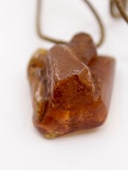Leather strap with amber pendant